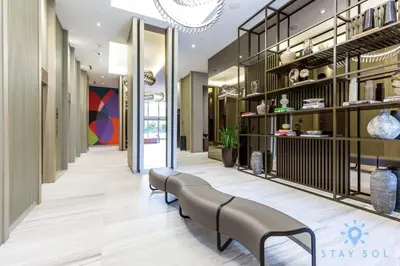 a lobby with a row of benches in a building at Wrap Around Balcony-Awesome View-Amazing Pools in Hollywood