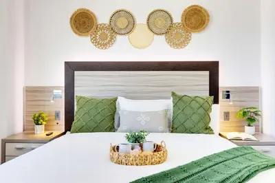 a bedroom with a large bed with two baskets on it at Beachfront Resort Pool Ocean View Balcony Gym in Aventura