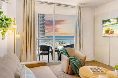 a living room with a view of the ocean at Beachfront Resort Pool Ocean View Balcony Gym in Aventura
