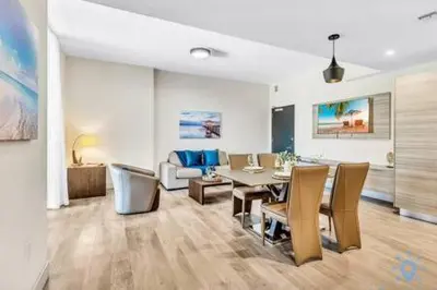 a dining room and living room with a table and chairs at Condo Bay View Infinity Pool Beach Service in Hollywood