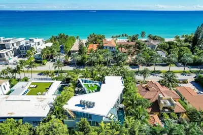 an aerial view of a resort with the ocean in the background at Villa Loggia Oasis Luxurious 6BD ,7BA with Resort Style Pool in Golden Beach