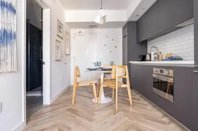 a dining room with a table and chairs in a kitchen at Boutique Condo in DT Miami Perfect for Couples/Fam in Miami