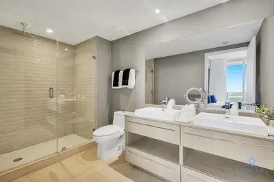 a bathroom with a toilet and a sink and a shower at Beach House Design in Hollywood