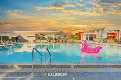 a pool with a pink flamingo in the water at Hollywood Bliss - Near Beach Studio - Rooftop Pool in Hollywood