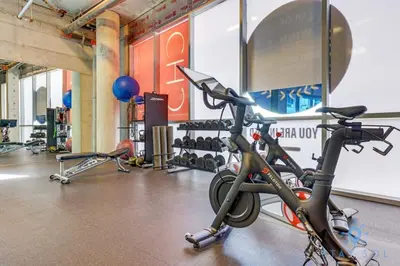 a gym with a bike parked in a room at Hollywood Bliss - Near Beach Studio - Rooftop Pool in Hollywood
