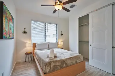 a bedroom with a bed and a ceiling fan at Modern New Construction Villa in Hollywood
