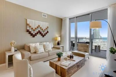 a living room with a couch and a table at Oceanfront Elegance - Sunset Views, Pet-Friendly in Hollywood