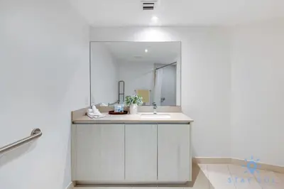 a bathroom with a sink and a mirror at Oceanfront Elegance - Sunset Views, Pet-Friendly in Hollywood