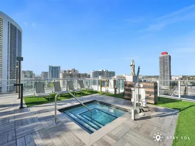 a swimming pool on the roof of a building at Oceanfront Elegance - Sunset Views, Pet-Friendly in Hollywood