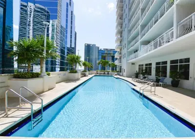 a swimming pool in the middle of a building at FREE Dinner at Crazy About You Restaurant in Miami