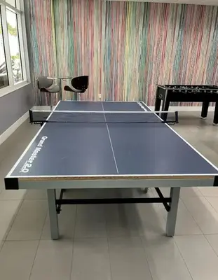 a ping pong table with two chairs in a room at FREE Dinner at Crazy About You Restaurant in Miami