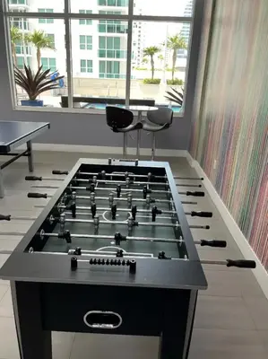 a large game room with a large pool table at FREE Dinner at Crazy About You Restaurant in Miami