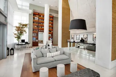 a living room with a couch and a table at MonteCarlo Miami Beach in Miami Beach