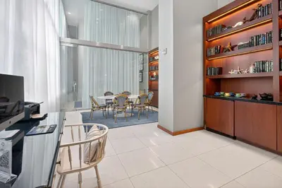 a kitchen and dining room with a table and chairs at MonteCarlo Miami Beach in Miami Beach