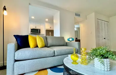 a living room with a couch and a table at Modern / Central / Free Pkg in Miami Beach