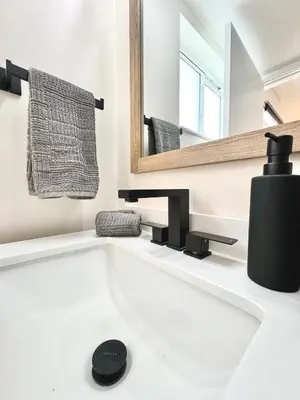 a bathroom with a white sink and a mirror at Modern / Central / Free Pkg in Miami Beach