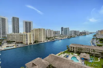 a view of a river in a city with buildings at Resort Amenities - Amazing Pool and Gym in Hallandale Beach