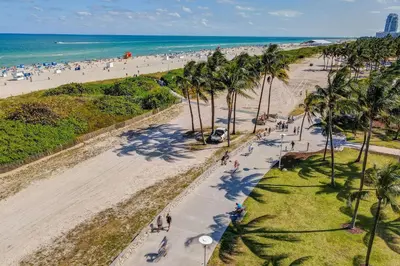 an aerial view of a beach with palm trees at Chic Large Studio Apt Near Ocean Drive South Beach in Miami Beach