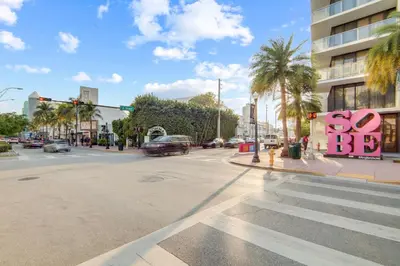 an empty street with a stop light and a sign that says so at Comfy 1 B/R, Near Ocean Dr & Beach - South Beach in Miami Beach