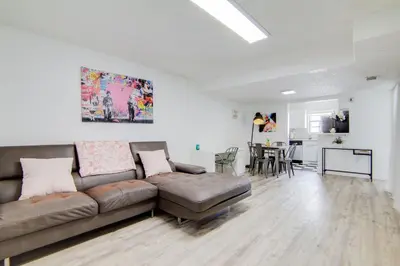 a living room with a couch and a dining room at 2B/2B, Free Parking, South Beach, 1 Block 2 Beach in Miami Beach