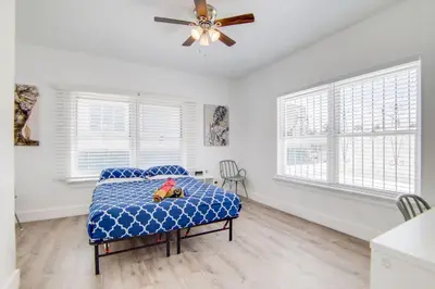 a bedroom with a bed and a ceiling fan at 2 B/R- Heart of South Beach, Near Ocean Dr & Beach in Miami Beach