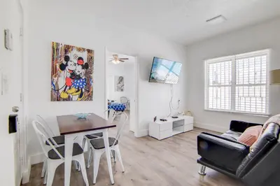 a living room with a table and a dining room at 2 B/R- Heart of South Beach, Near Ocean Dr & Beach in Miami Beach