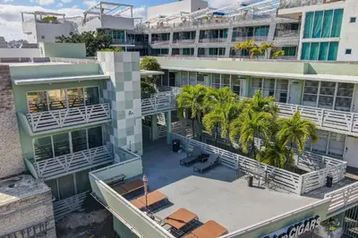 an overhead view of a building with palm trees at Balcony Beach View w/2 Queen beds, Ocean Dr Beach in Miami Beach