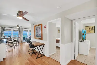 a living room and dining room with a table and chairs at Beach Condo 2BR & Efficiency Combo on Hollywood Beach in Hollywood