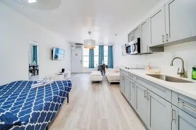 a kitchen and living room with a bed and a sink at Beachy 1 b/r, w/2 Queen Beds, On Ocean Drive Beach in Miami Beach