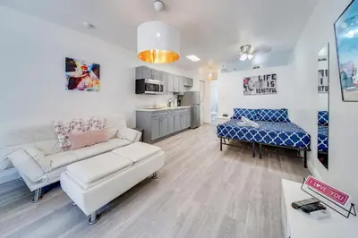 a living room with a couch and a table at Beachy 1 b/r, w/2 Queen Beds, On Ocean Drive Beach in Miami Beach
