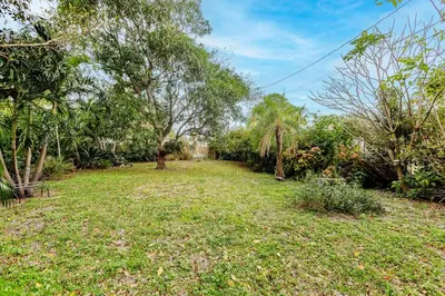 an open yard with trees and grass at Uhost AI - Updated 1B1B Hideaway - Sleeps 3 in Hollywood