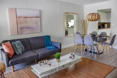 a living room with a couch and a table at Suites at Coral Resorts in Miami