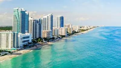 an aerial view of a beach with buildings and the ocean at Walk to the beach, Studio, with Pool and FREE Parking in Hallandale Beach
