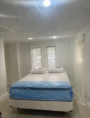 a bed in a room with a window at CHEERFUL PRIVATE ROOM 2 MILES AWAY FROM SUNNY ISLES BEACH in North Miami Beach