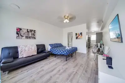 a living room with a couch and a chair at Fresh Ocean Dr, Apt w/2 Queen Beds-Steps 2 Beach in Miami Beach