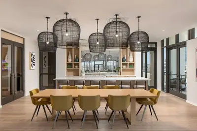 a dining room with a table and chairs and chandeliers at Wynwood 1br w gym pool wd nr shops bars MIA-34 in Miami