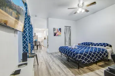 a bedroom with a bed and a ceiling fan at Balcony Deco Apt, w/2 QueenBeds, on Ocean Dr Beach in Miami Beach