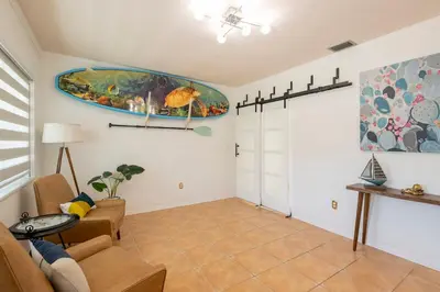 a living room with a couch and a table at Surfers Cove - Modern 3 2 w Pool near Calle 8 in Miami