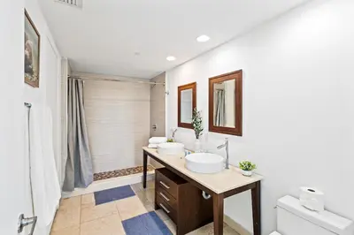 a bathroom with two sinks and a toilet at Modern High Rise One Bedroom at Icon Brickell (W) in Miami