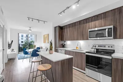 a kitchen with a stove and a counter top at Sleek Doral Retreat 1 Bed Oasis With Free Parking in Hialeah Gardens