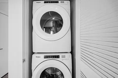 a washer and a washing machine in a room at Sleek Doral Retreat 1 Bed Oasis With Free Parking in Hialeah Gardens