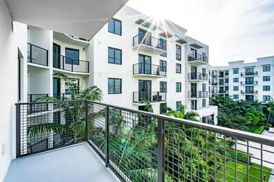 a balcony of a apartment building with a railing at Sleek Doral Retreat 1 Bed Oasis With Free Parking in Hialeah Gardens