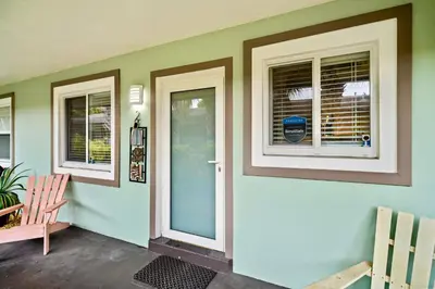 a front door of a house with two windows at Wilton Manors 2BR Charm! Walk to the Drive in Fort Lauderdale