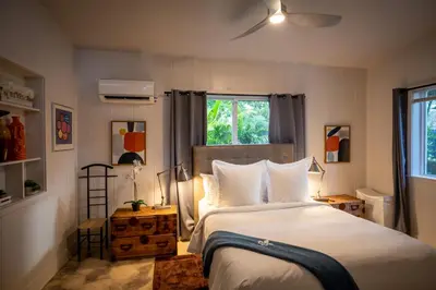 a bedroom with a bed and a window at Walk to Wilton Drive - Spacious & Quiet Villa #2 HOT TUB! in Fort Lauderdale