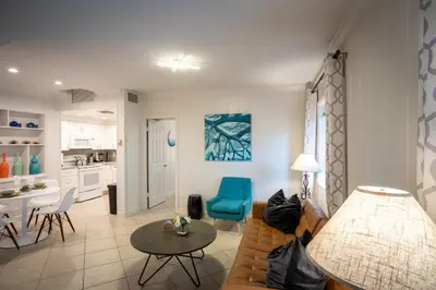a living room with a couch and a table at Walk to Wilton Drive - Spacious & Quiet Villa #1 in Fort Lauderdale