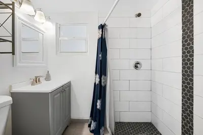 a bathroom with a shower and a sink at Perfect FLL Location with Putting Green in Fort Lauderdale