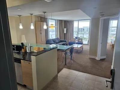 a kitchen and living room with a table and chairs at Mare-1708 A in Aventura