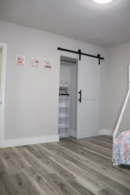 an empty room with a closet and a door at Flamingo Beach House in Dania Beach