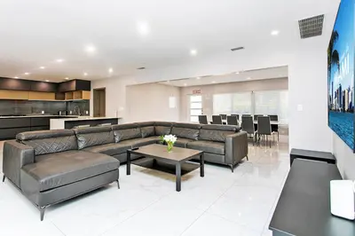 a living room with a couch and a table at Premium Luxury 5BR & 3BA Villa near Hollywood Beach in Hollywood