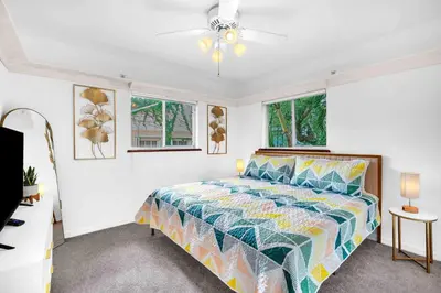 a bedroom with a bed and a ceiling fan at Center Grove - Lush & Spacious & New - 3 Bedrooms in Miami